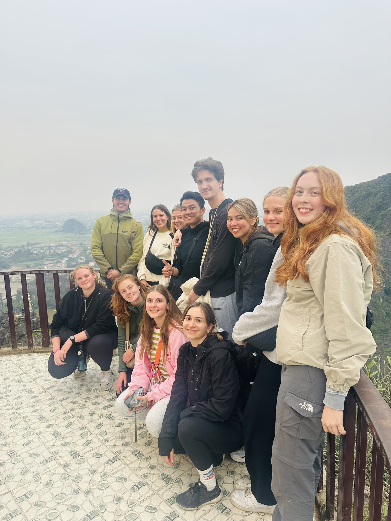Crystal clear water and lush greenery of the Trang An valley